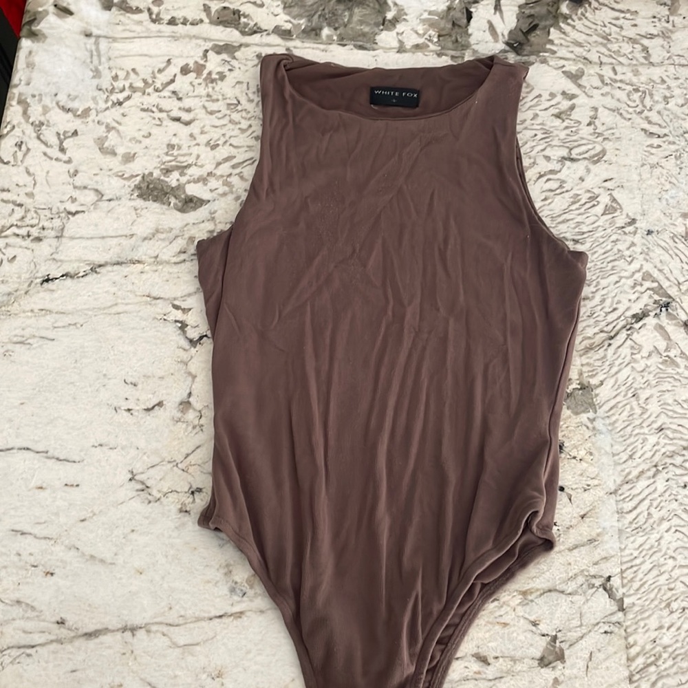White fox, brown body suit
